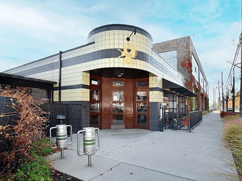 Griffin Claw with a curved facade and a large mural at Eton Square Apartments and Townhomes, Michigan, 48009